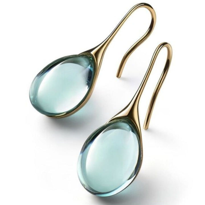 BOUCLES D’OREILLES EN CRISTAL D’OR ET D’ARGENT